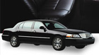 Black luxury sedan with chrome accents.
